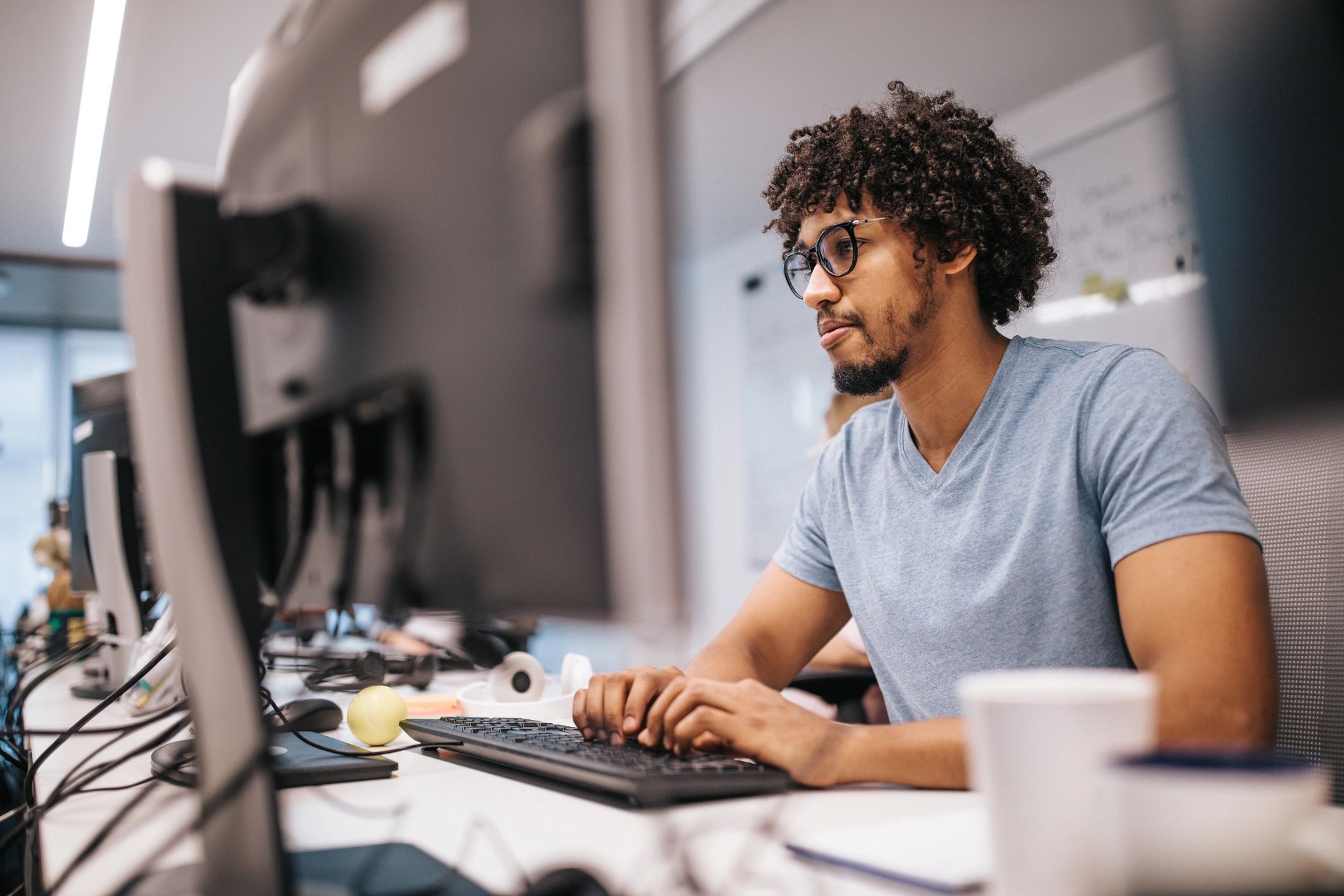 Software developer working at a desktop computer